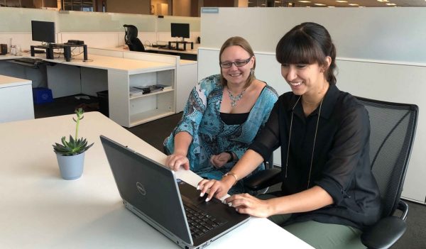 Janelle Gagné working with colleague Isabelle Groulx at Stantec’s Ottawa, Ontario, office.