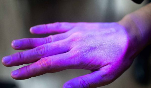 Hand under UV light