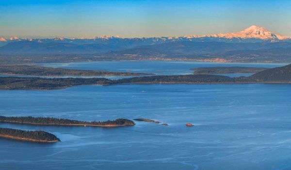 Aerial view from the San Juan Islands with Mount Baker on the horizon