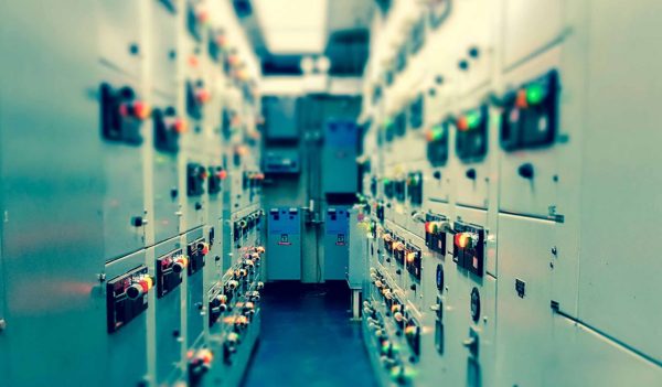 Vintage and blur tone of Electrical switchgear room,Industrial electrical switch panel on plant  and process control with grainy style.