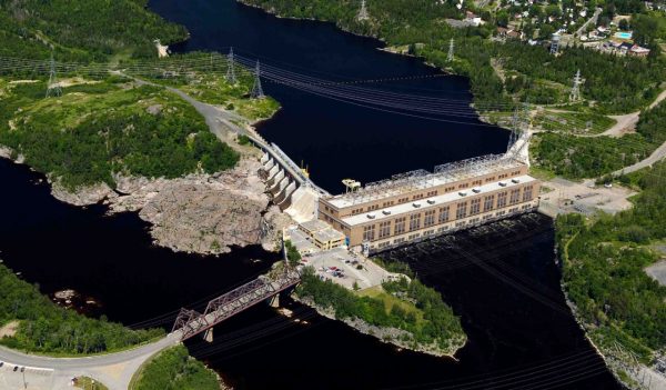 Aerial view of hydropower plant and dam.