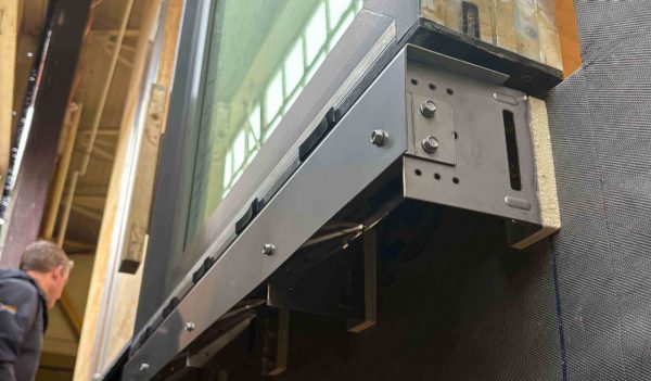 Akira Window Connection installed for a swing door mock-up in a mass timber wall system. 