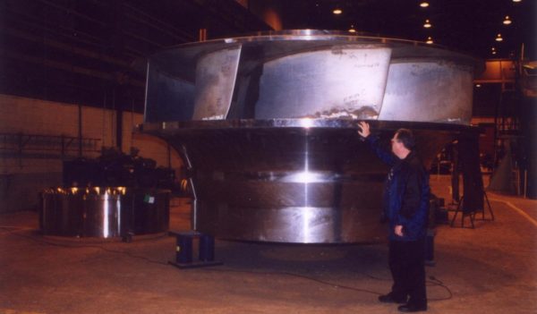 Stanley Hayes inspecting a pump turbine