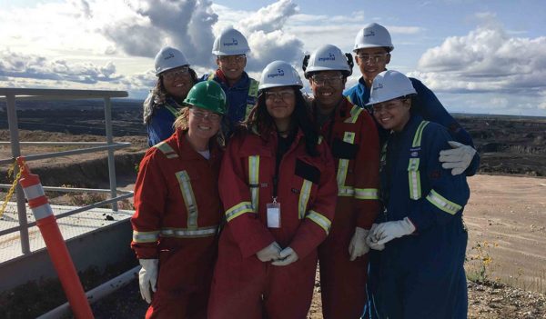 A group of the OYEP participants pause for a photo while touring Imperial Kearl’s open pit oilsands mine.