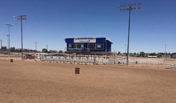 A rodeo arena with stands and view platform