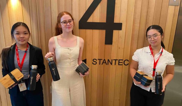 Students showing off their Stantec swag.