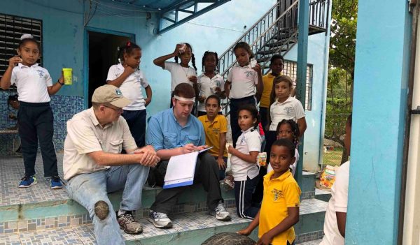 Dwight Harrienger (left) from our Rochester, NY office at an EWB-USA project in the Dominican Republic.