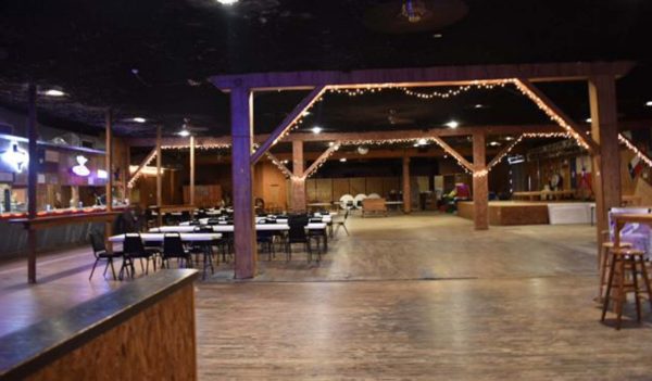 Interior of the dance hall with dance floor, tables, and chairs