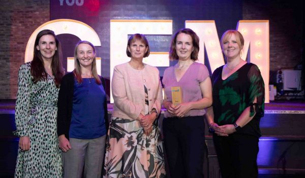 Photo of team accepting GEM Award, Stantec employee Catherine Green pictured second from the right