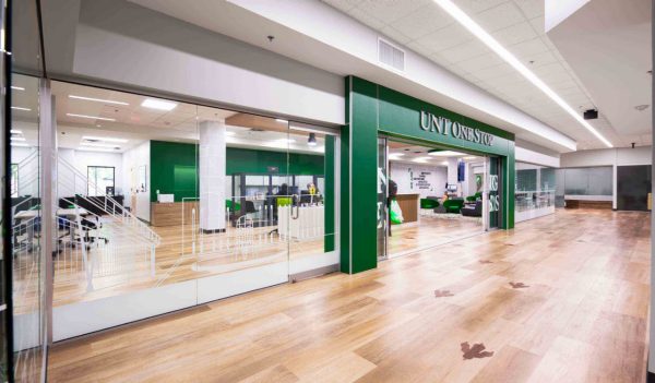 Interior view of the student center entrance with a large green frame over the doorway.