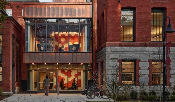 Exterior main entrance with walkway and plantings