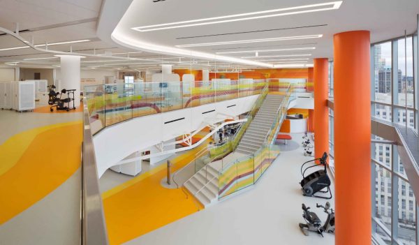 View from the upper level to open space below with exercise equipment