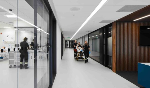 A person on a gurney being brought into the facility