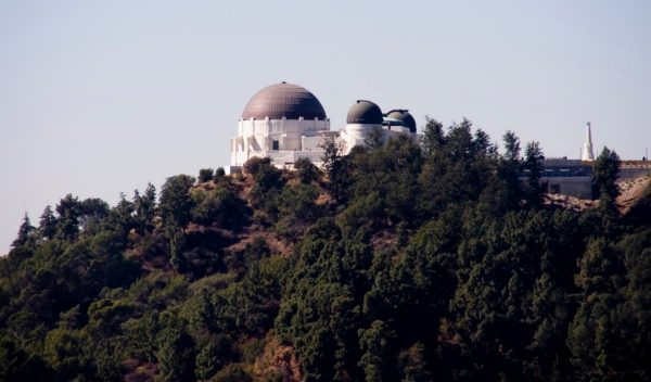 Domed building on top of a treed hill