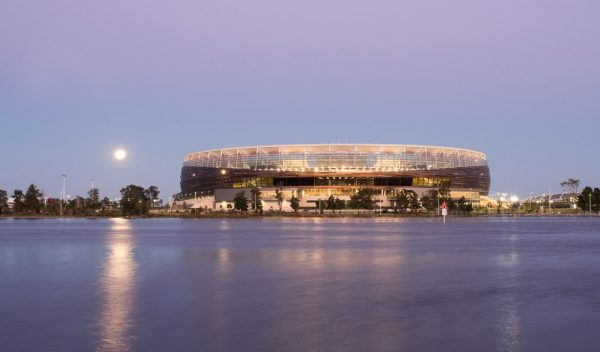 View of the stadium from across the lake lit up at night