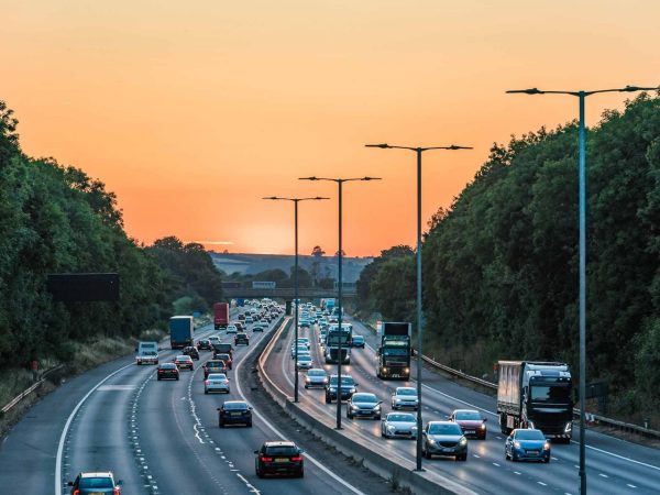 Sunset view of busy UK Motorway traffic in United Kingdom
