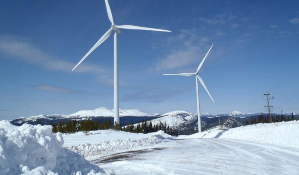 Wind turbines in snow covered terrain