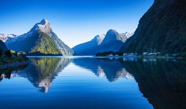Mitre Peak at Milford Sound in south island, New Zealand in the morning in autumn. The mountain and the reflection in the sea